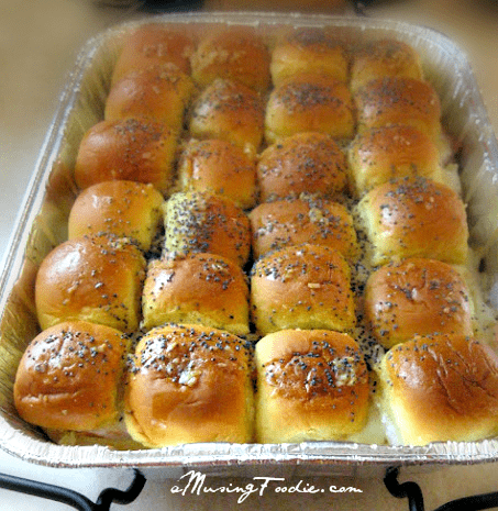 Golden-brown ham and cheese rolls, perfect for family gatherings and deliciously inviting.