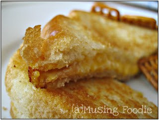 Golden grilled cheese sandwich with gooey cheese and crunchy pretzels, ideal for comfort food lovers.