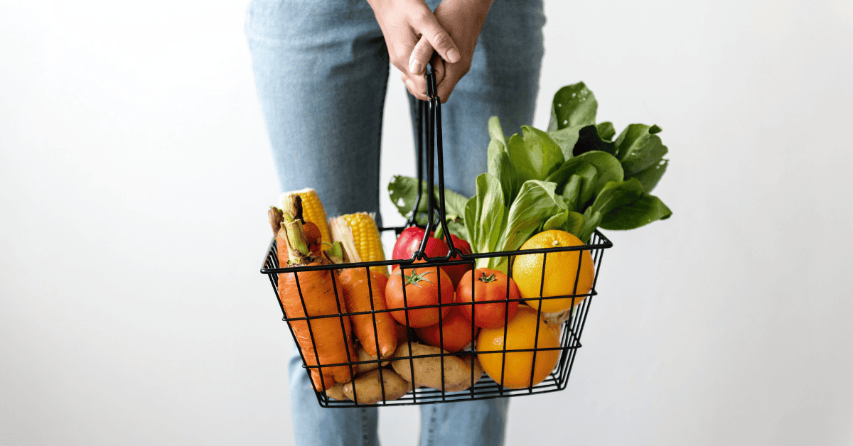 Colorful fresh produce in a wire basket promoting healthy eating and vibrant living.