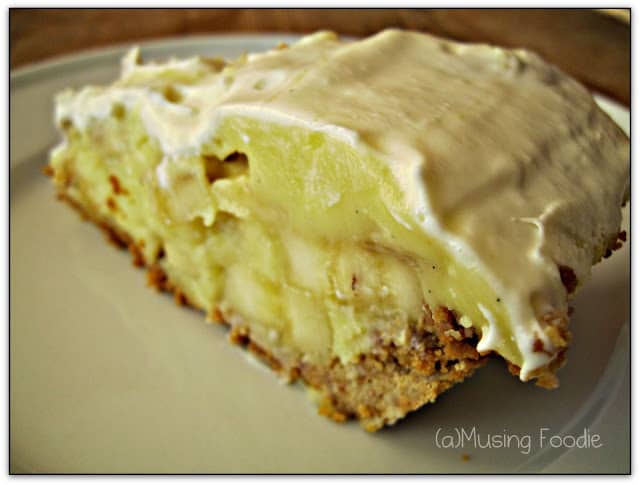 Indulgent slice of banana cream pie with creamy custard, fresh bananas, and fluffy whipped cream.