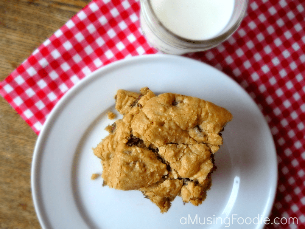 Irresistible chocolate chip cookie bars served with a refreshing glass of milk.