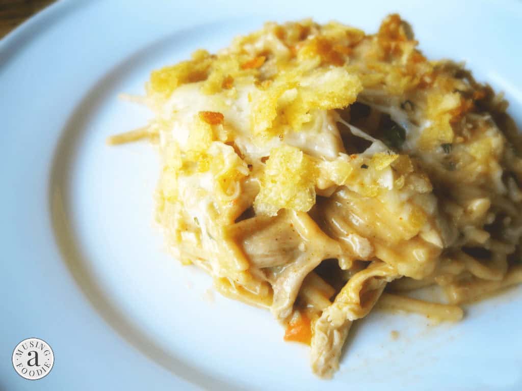 Crispy-topped creamy chicken spaghetti casserole, a comforting dish filled with flavor and texture.