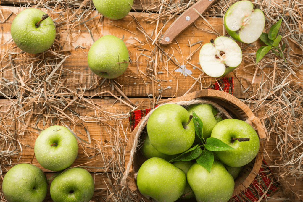 Vibrant green apples in a rustic basket, capturing the essence of fresh farm produce.