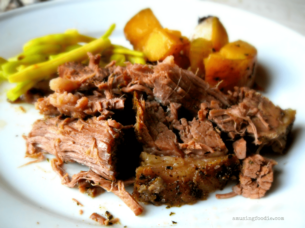 Hearty shredded beef served with roasted vegetables for a comforting home-cooked meal.