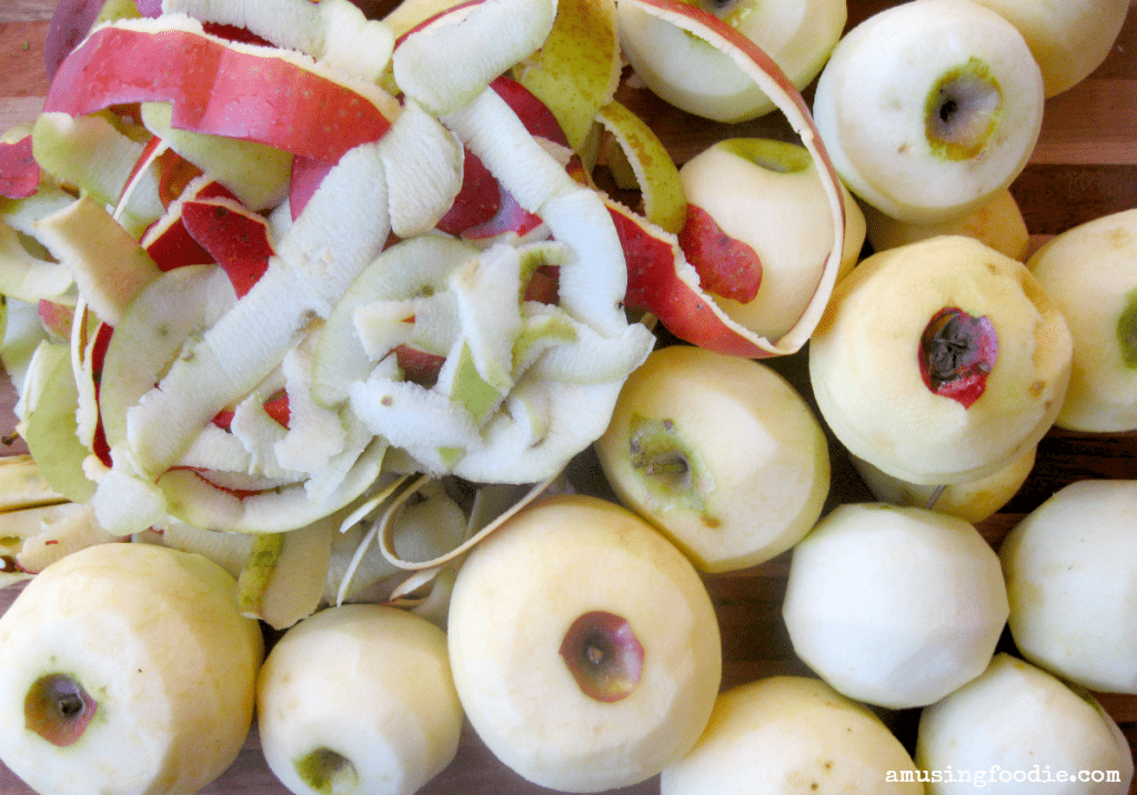 Vibrant apples and peels ready for homemade pies or fresh apple sauce delights.