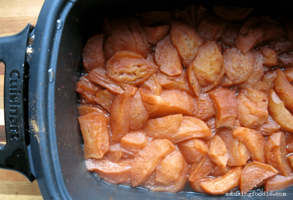 Delicious caramelized apples in a slow cooker, perfect for autumn desserts and comfort food.
