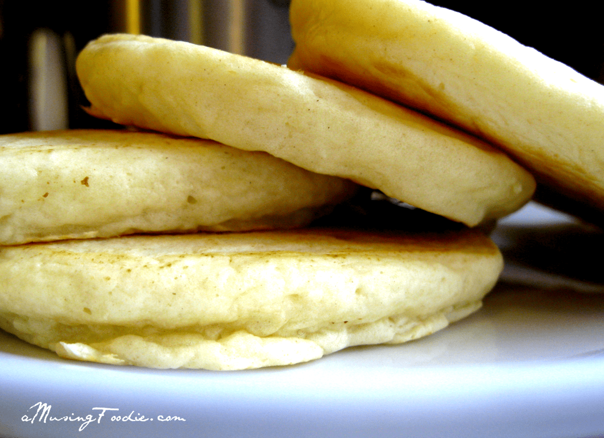 Delicious stacked golden brown pancakes, perfectly fluffy and inviting for a delightful breakfast experience.