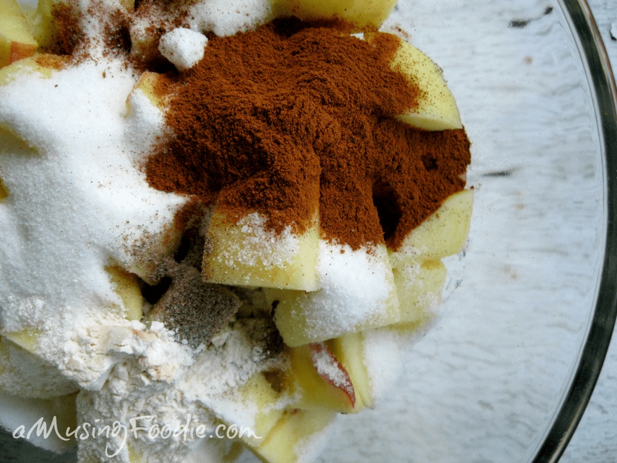 Chopped apples with sugar, cinnamon, and honey for a delicious chunky apple pie.