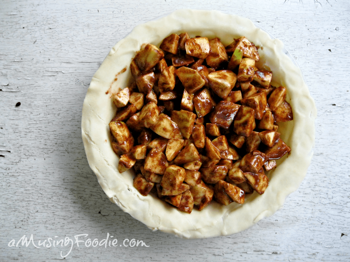 Golden Honey Cardamom Apple Pie, filled with chunky spiced apples, ready for baking.