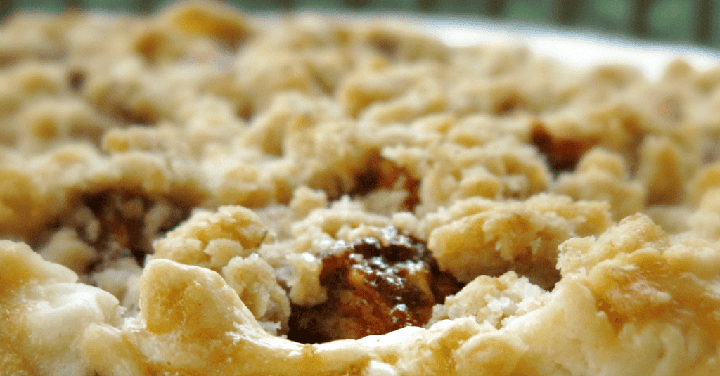 Delicious chunky apple pie with a golden crust, perfect for cozy gatherings and desserts.