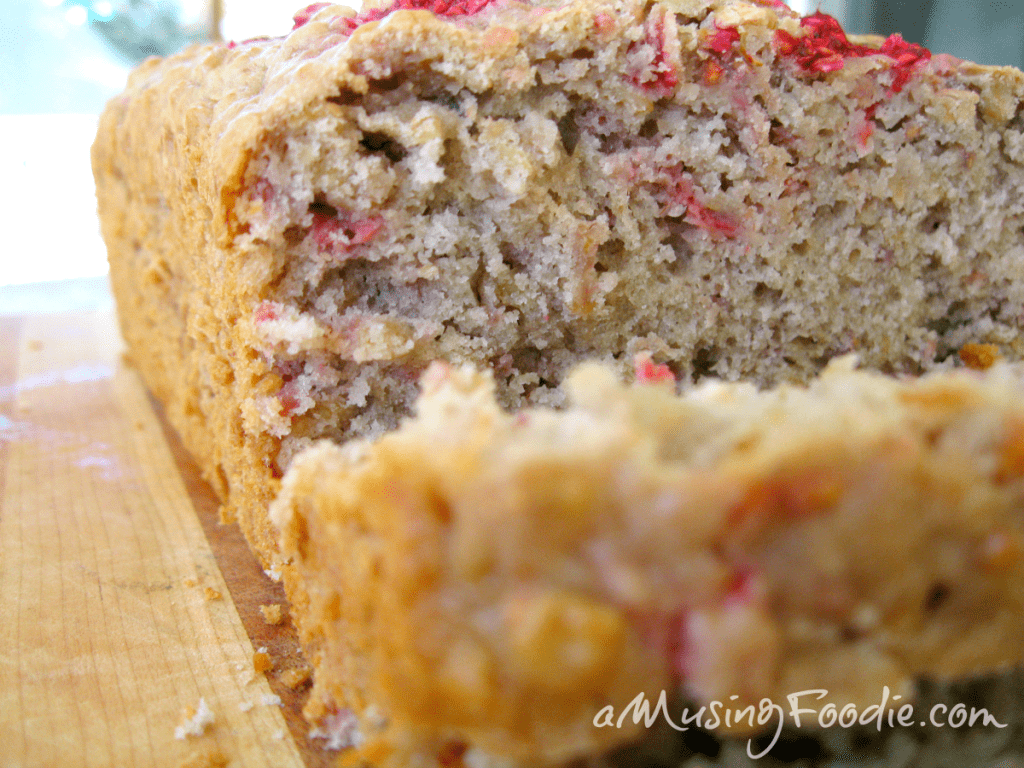 Freshly baked strawberry oatmeal bread slice with a golden crust and moist interior.