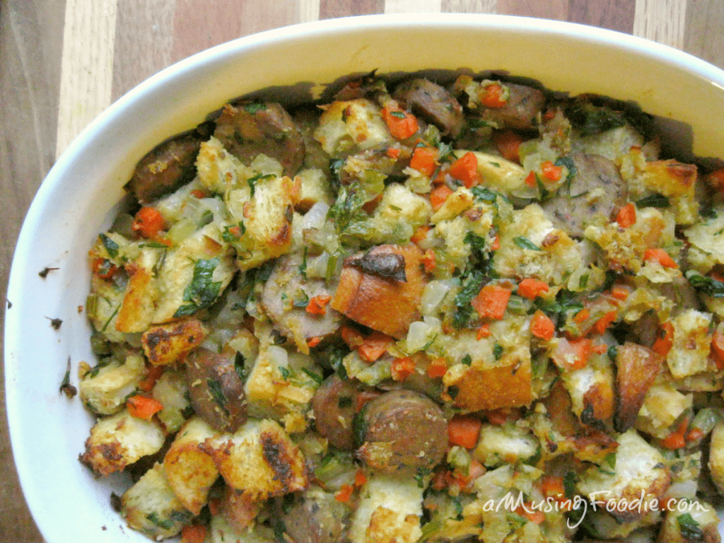 Delicious vegetarian sausage stuffing bake with colorful vegetables and perfectly baked bread on a rustic backdrop.