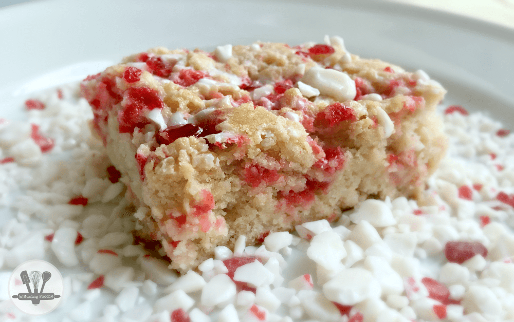 Delicious peppermint sugar cookie bars topped with crunchy festive decorations, perfect for holiday celebrations.