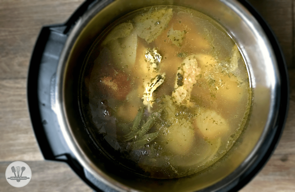 Delicious chicken stew simmering in a pressure cooker, perfect for quick and hearty meals.