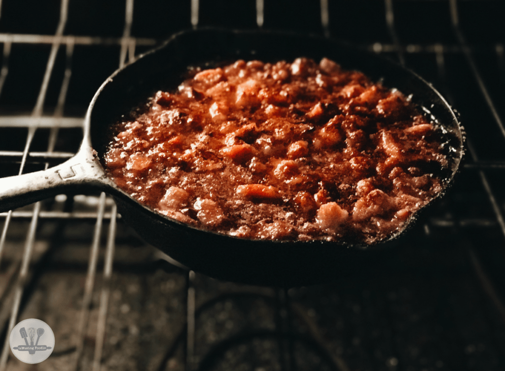 Crispy bacon in a cast iron skillet, perfect for hearty home-cooked meals.