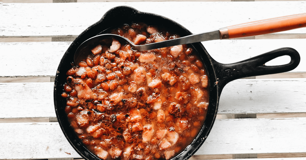 Delicious skillet beans with bacon, perfect for comforting family meals or gatherings.