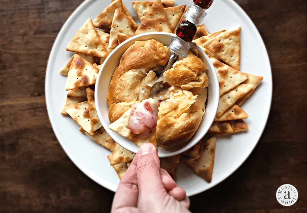 Delicious creamy dip with crispy crackers, perfect for entertaining and festive gatherings.