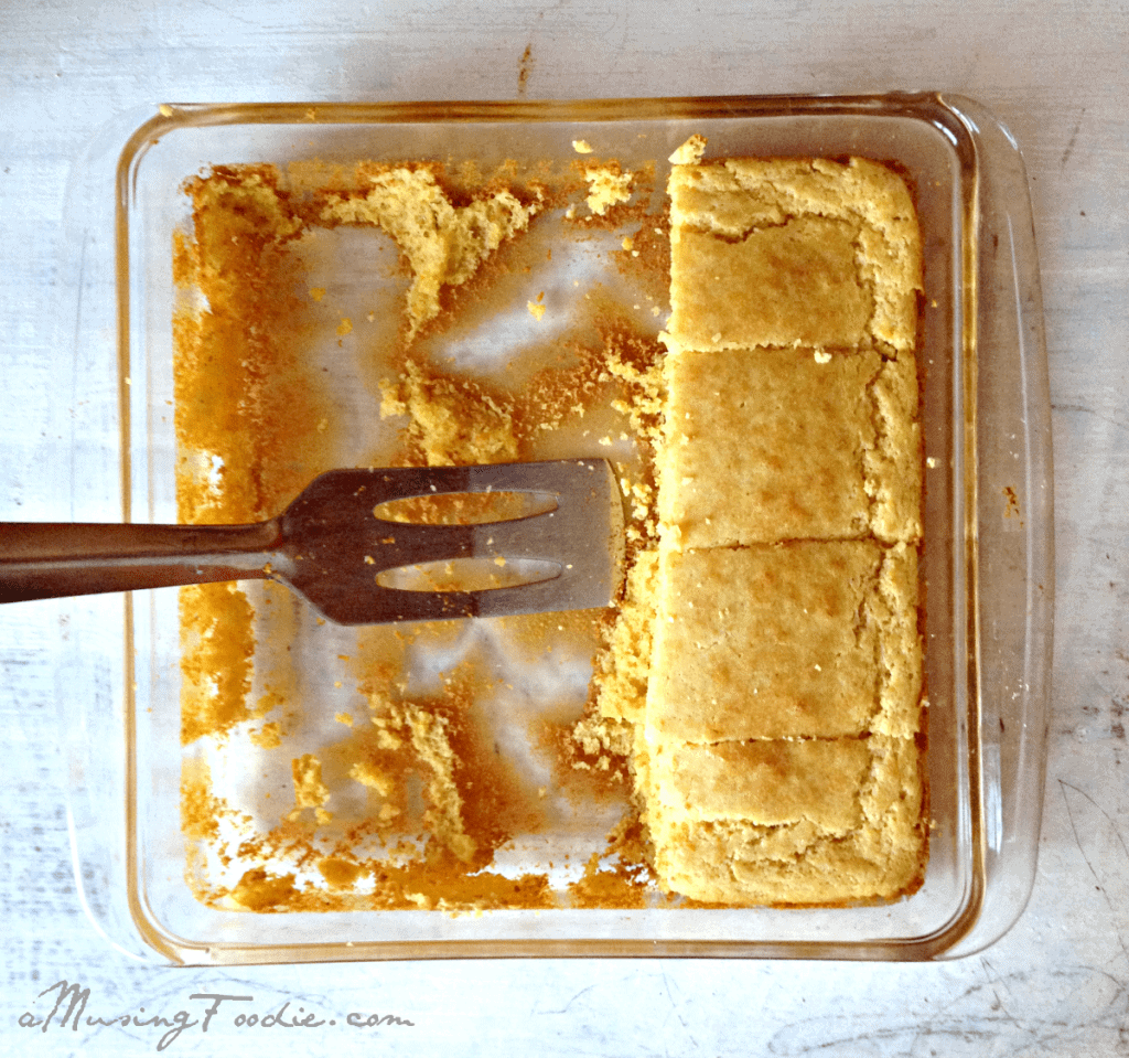 Warm, golden cornbread in a baking dish, ready for serving at a family gathering.