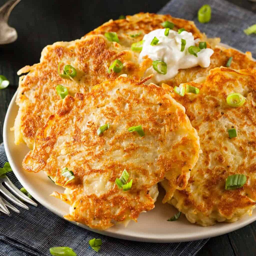 Irish potato pancakes sprinkled with sliced onion leaves