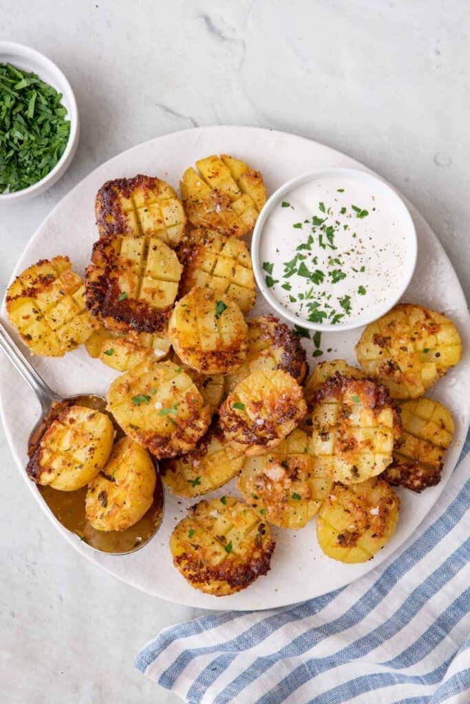 Parmesan Potatoes with dip on a plate