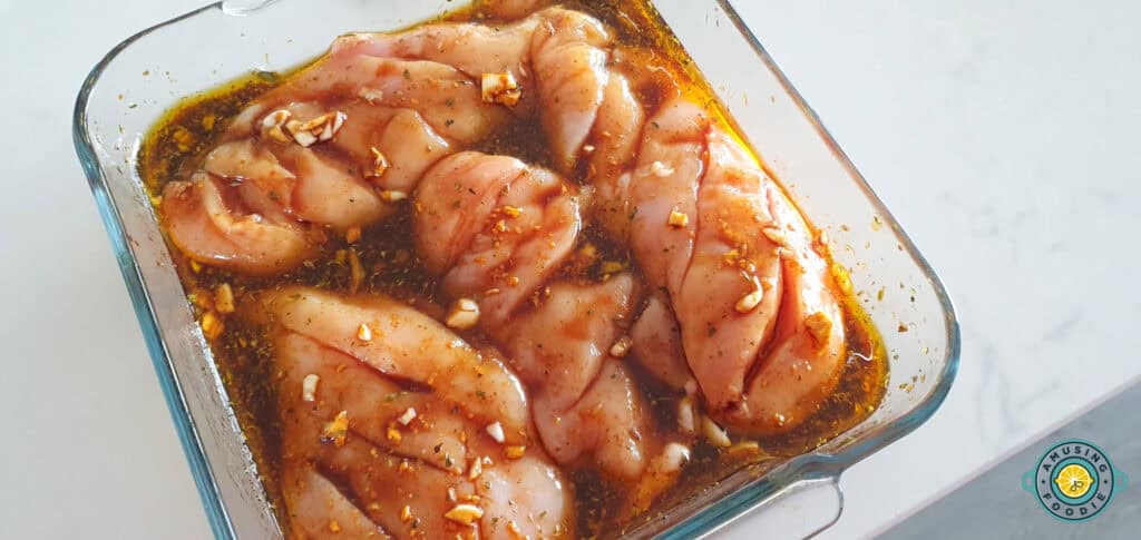 Chicken being marinade