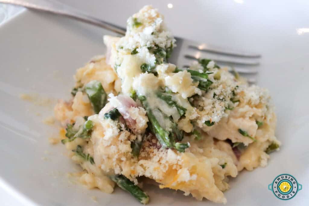 Chicken broccoli on plate with fork