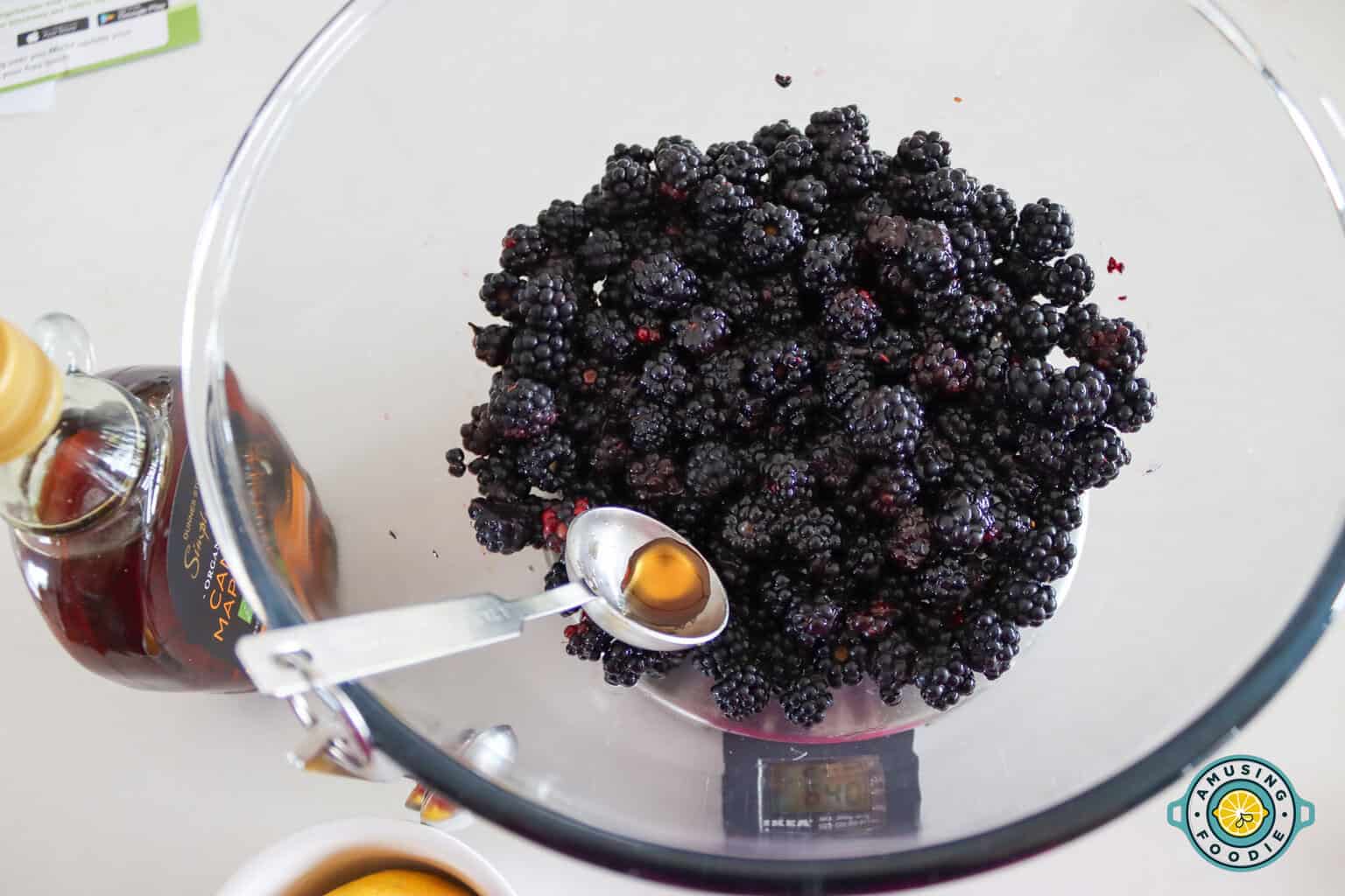 Blackberry on weighing scale with measuring spoon