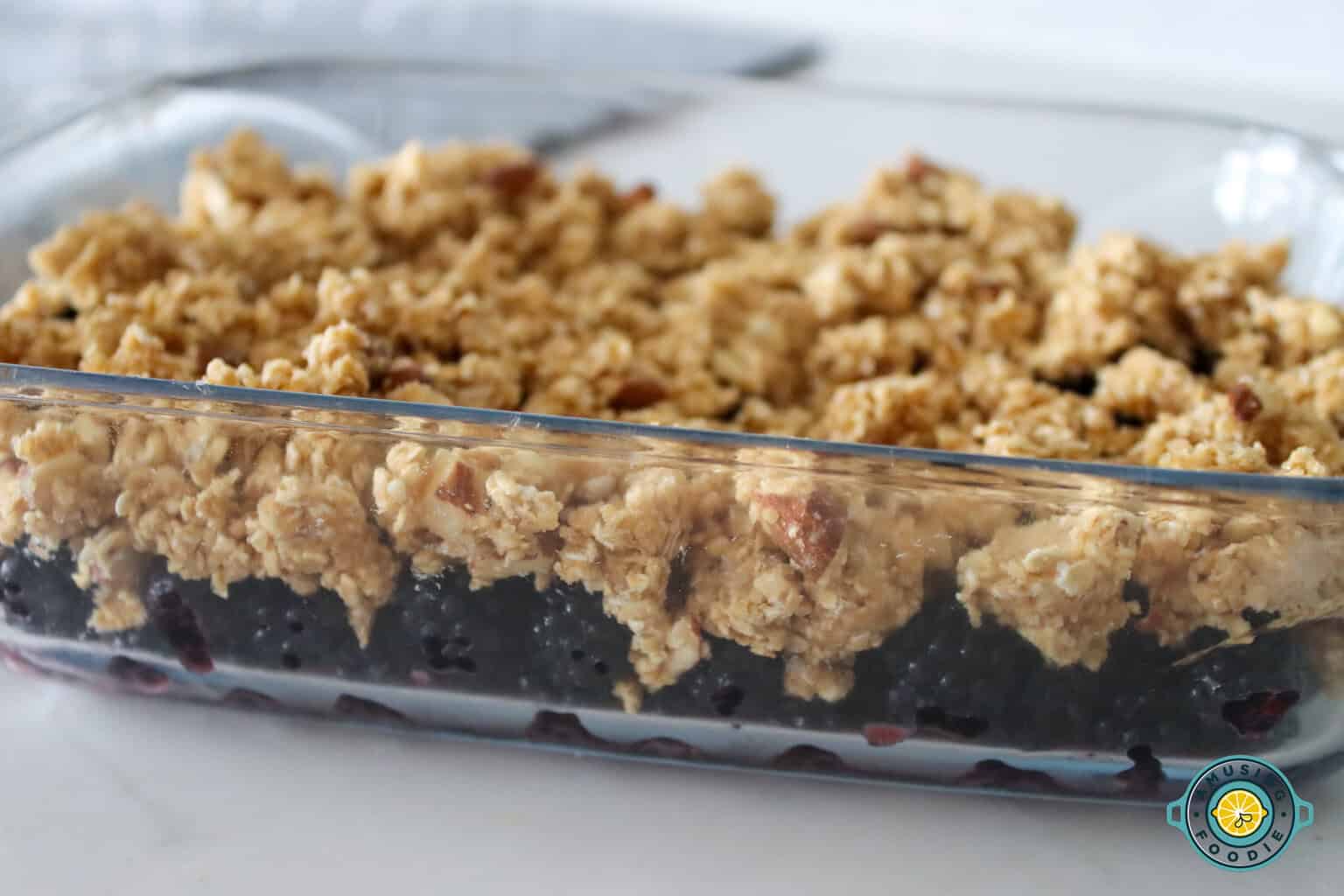 Mixed blackberry and crumble on glass tray