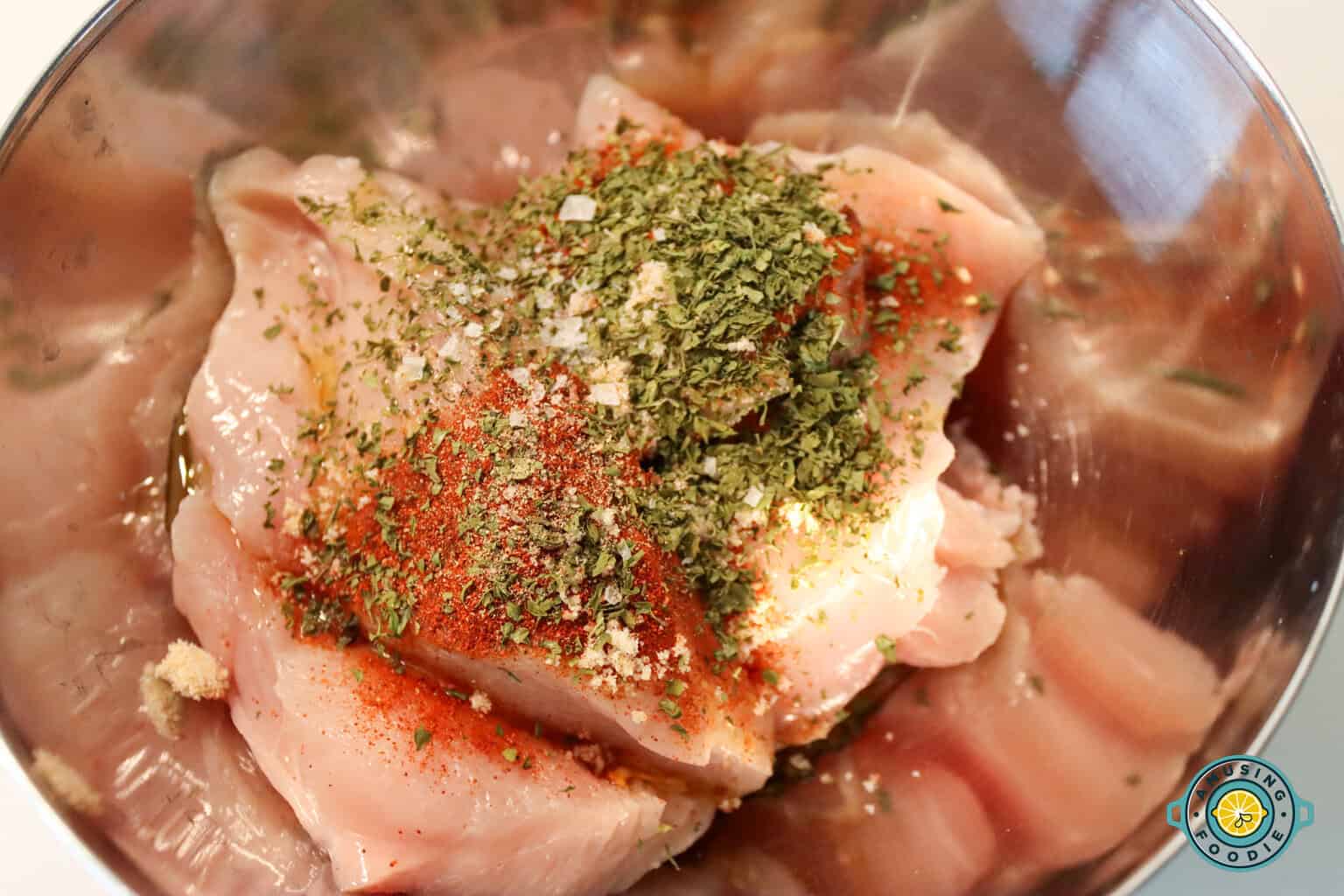 Seasoning raw chicken breast