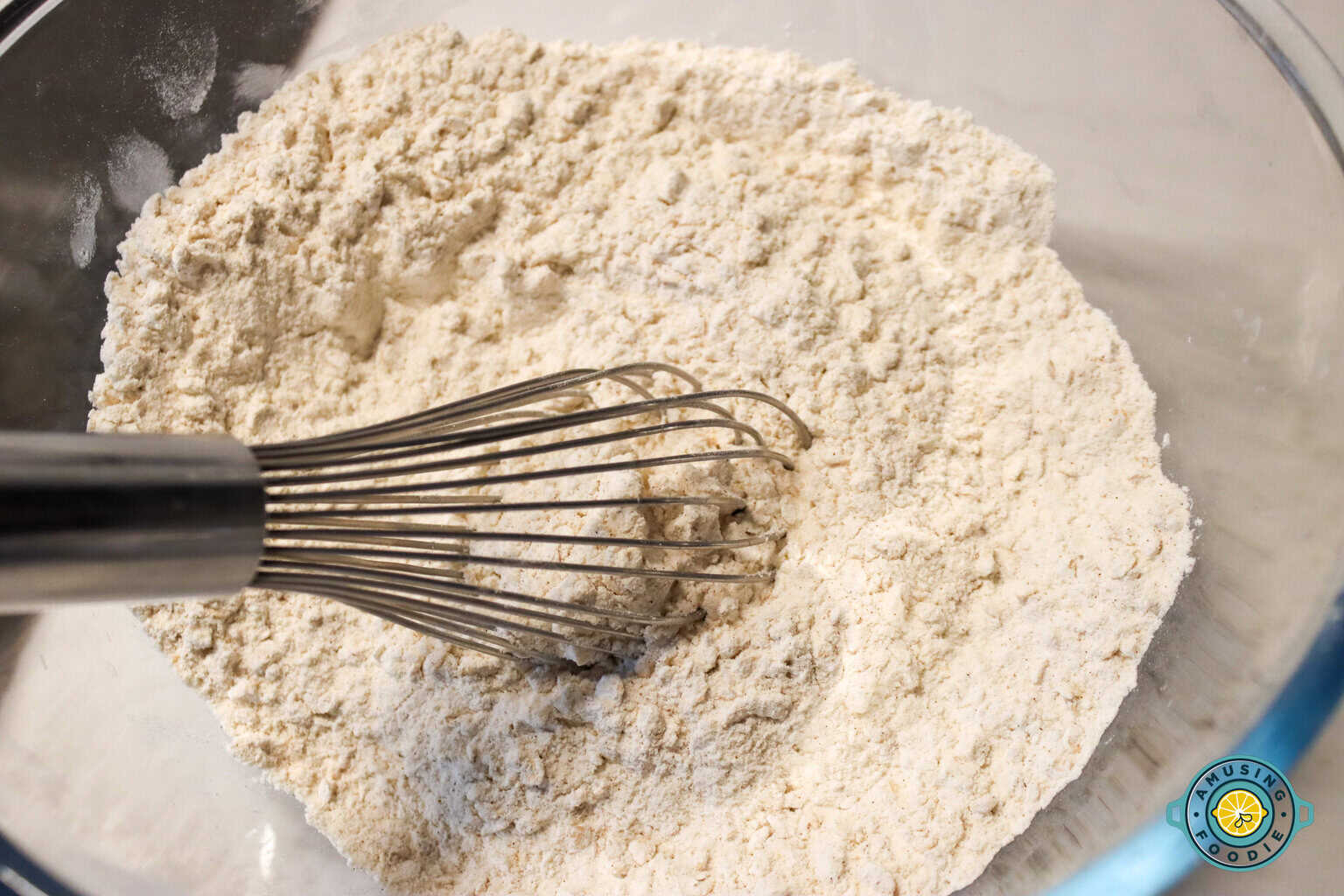 Flour and whisk on mixing bowl
