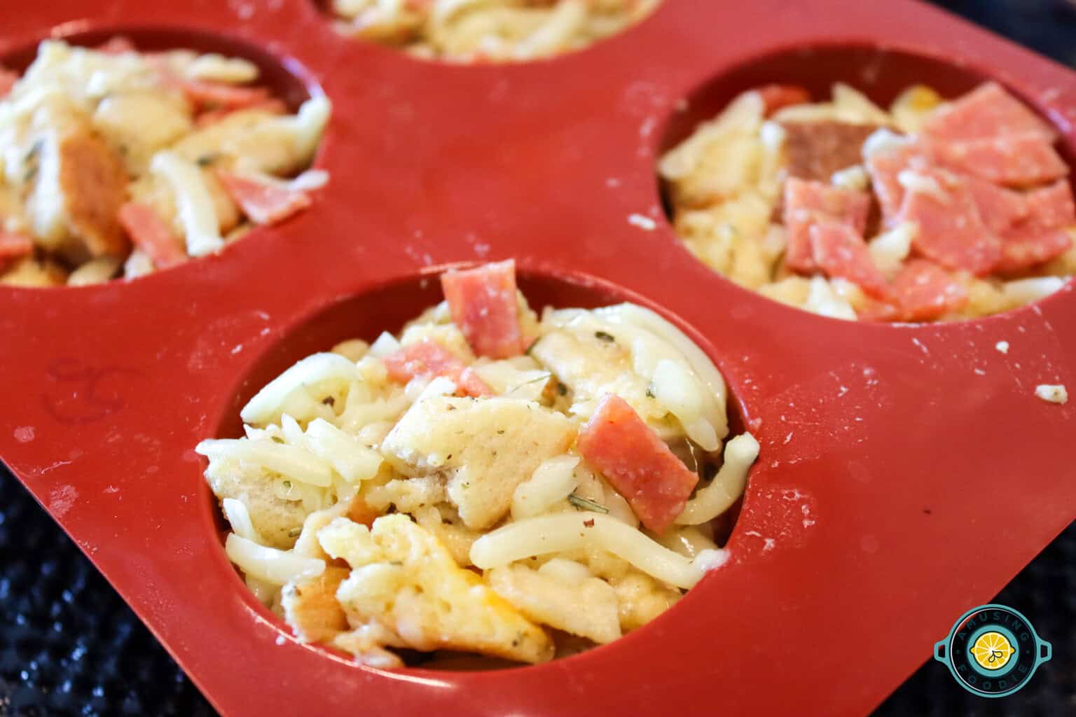 Pizza muffin mixture in a mold closeup
