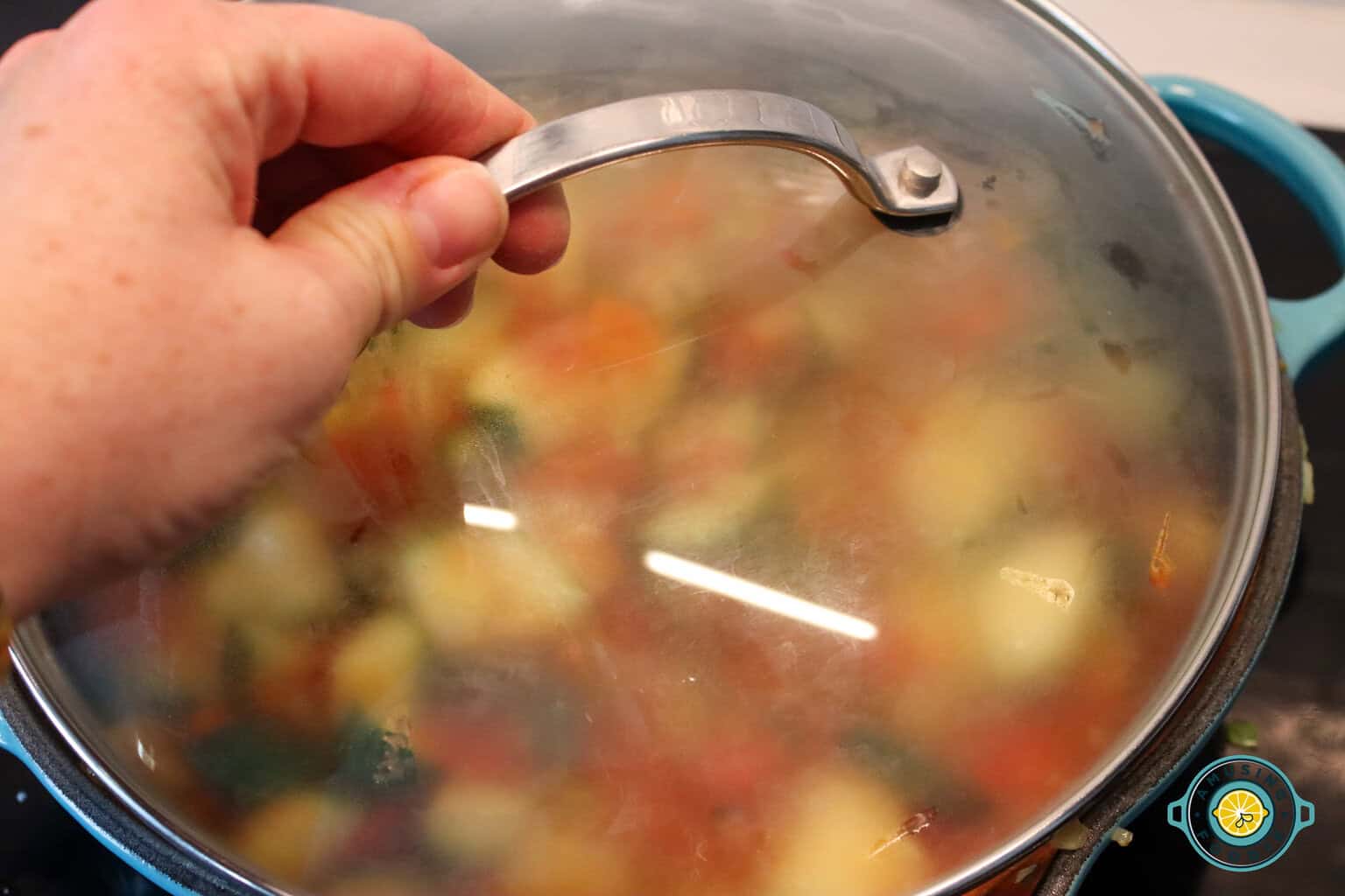 Putting on the pot lid