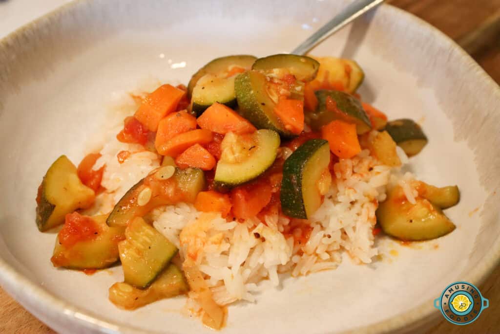 Zuchinni tomato stew on top of rice