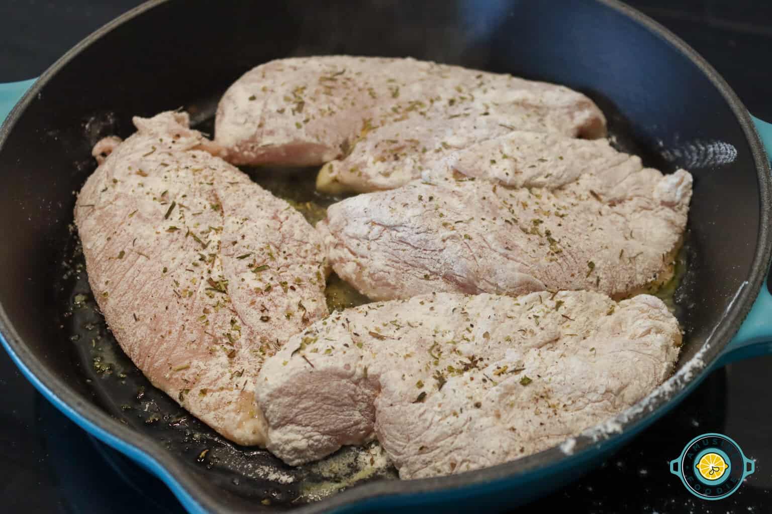 Frying coated chicken breasts