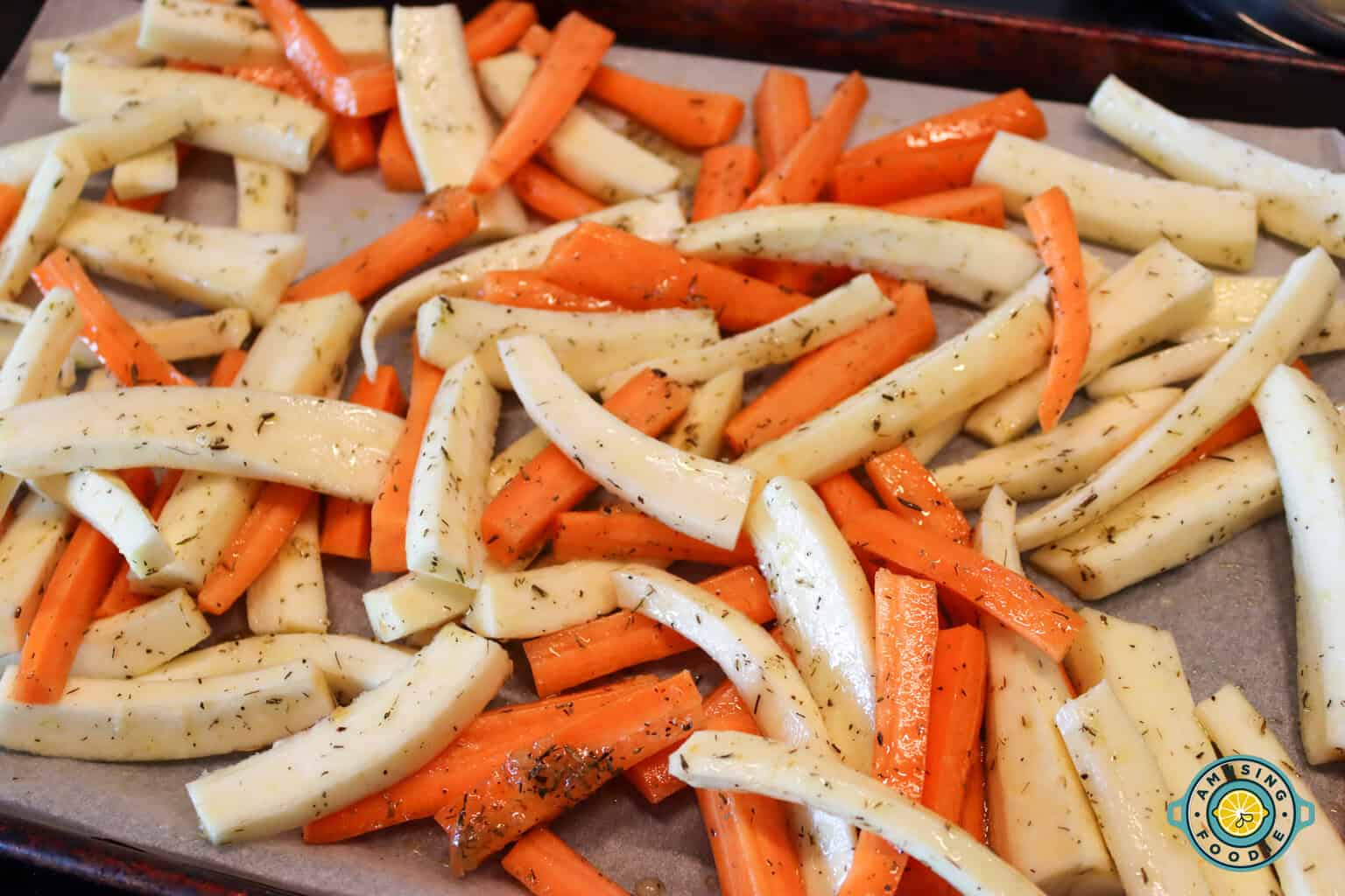 raw carrots and parsnips on sheet pan