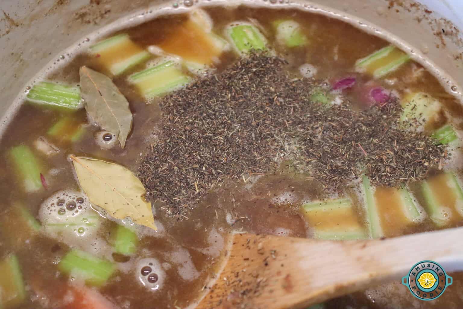 Adding pepper and bay leaves