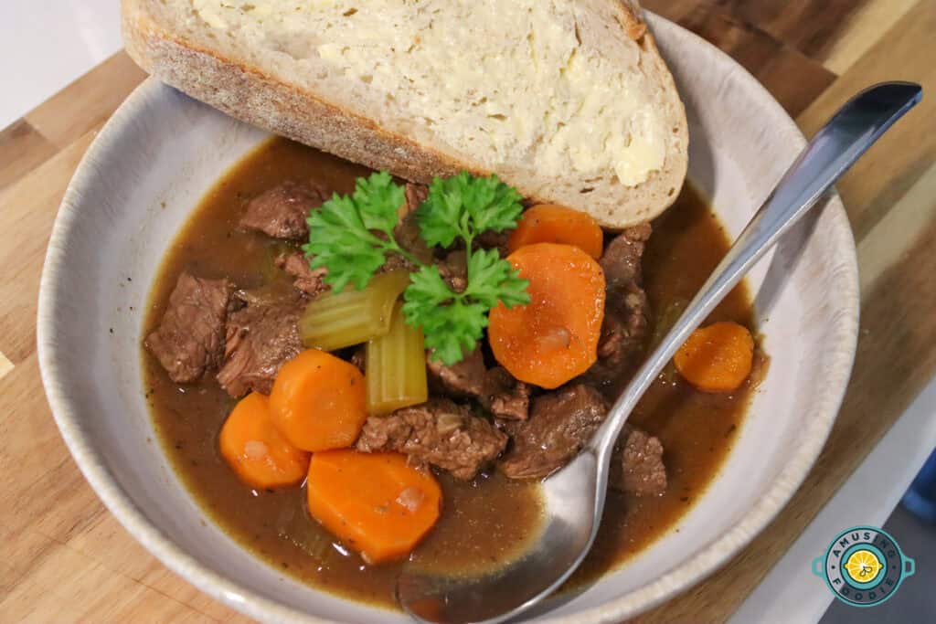 A bowl of Irish Guinness beef stew served with bread