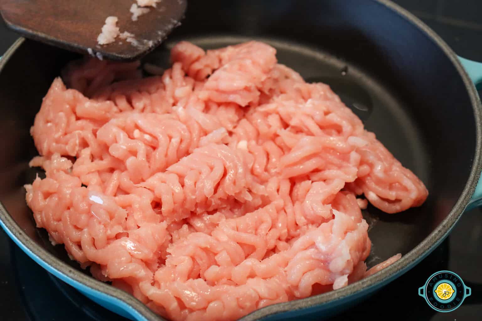 raw ground turkey on pan