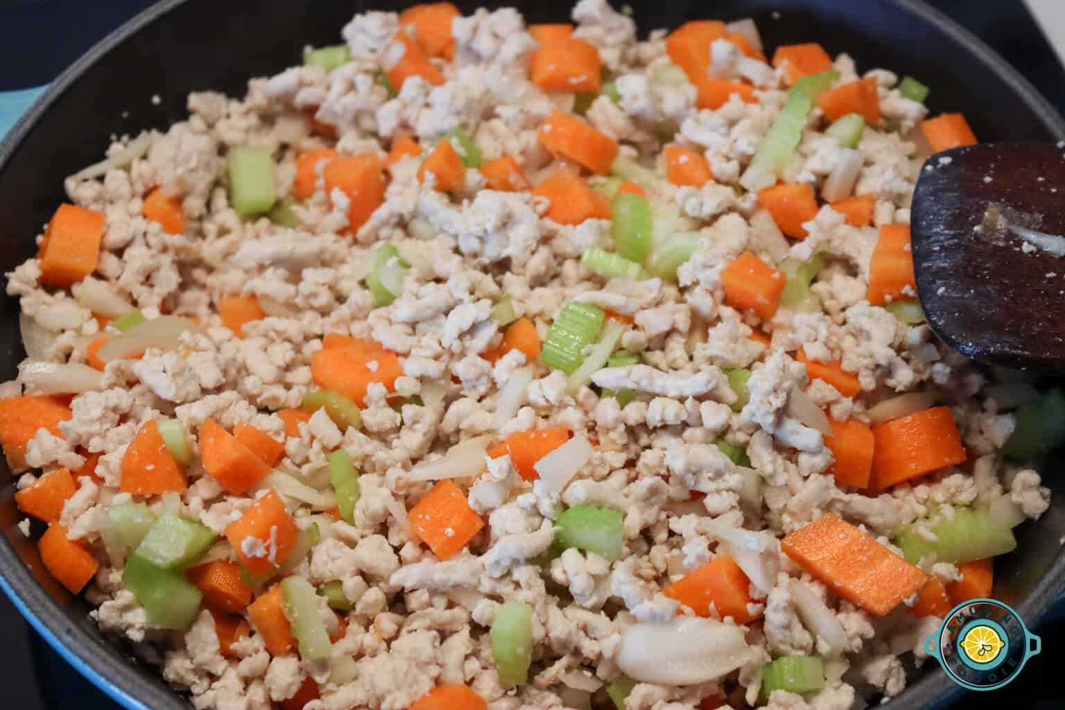 adding veggies on ground turkey